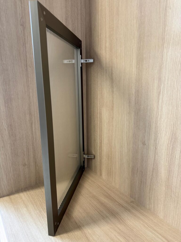 Single aluminum-framed glass cabinet door