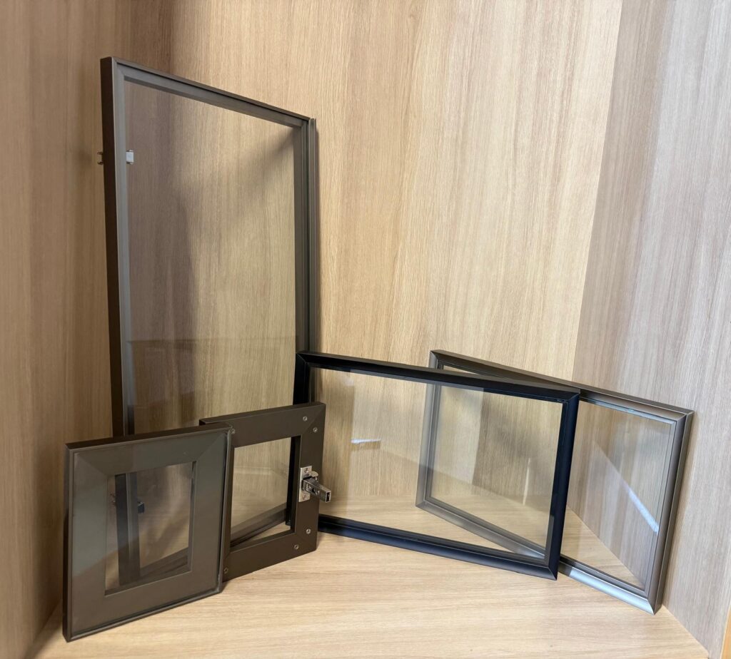 Aluminum-framed glass cabinet doors in several sizes