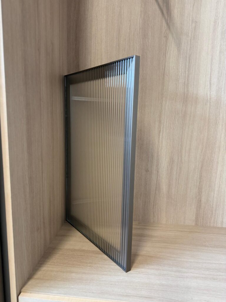 Aluminum-framed textured glass cabinet door