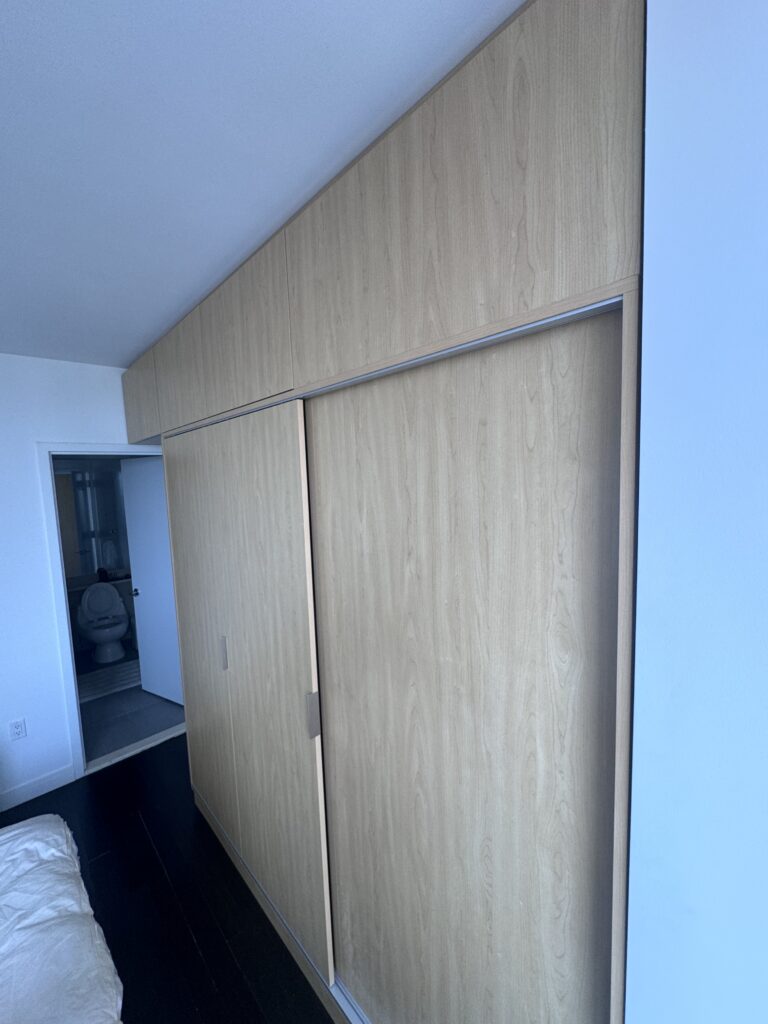 Wood veneer wall panels with sliding sections