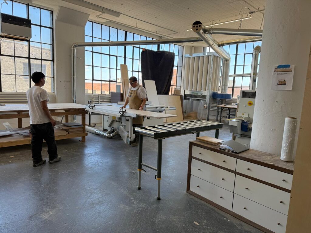 Workers in the Kobe Millwork shop in Industry City